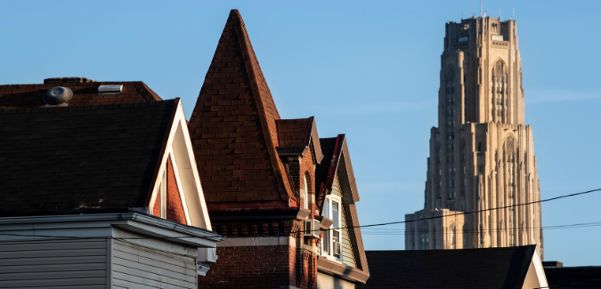 A photo of homes on an Oakland street. 